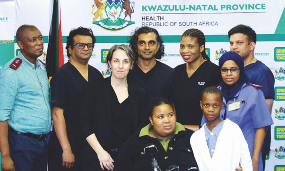 Thobani Ngcobo (CCU nursing operational manager), Dr Yakeen Harilall (head of cardiac perfusion), Dr Alexa de Castro (head of cardiac anaesthesia), Dr Manogran Moopanar (head of the clinical unit, cardiothoracic surgery and congenital cardiac surgeon), Dr Shabalala, Sister Tasneem Metadad (senior cardiac ICU sister), Sister Nokuphiwa Shazi (operational nursing manager for the cardiac surgical theatre), and Dr Linda Mtshali (acting CEO of Inkosi Albert Luthuli Hospital), together with Siyabonga Mthethwa (10).