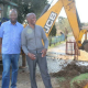 Selby Hlongwane and and Themba Gonwela outside their complex as the pipe is being repaired. Photo: Jarryd Westerdale