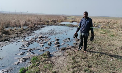 Njabulo Mzolo has to wade through the contaminated Rietspruit, putting his health at risk