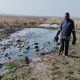 Njabulo Mzolo has to wade through the contaminated Rietspruit, putting his health at risk