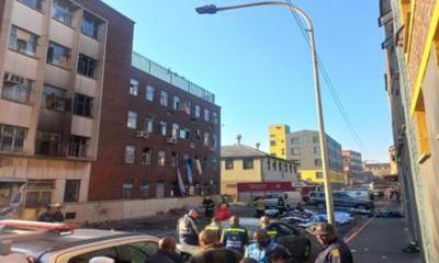 EMS personnel and police are seen on site in a building in Johannesburg that caught fire in the early hours of the morning in this image captured on 31 August 2023.