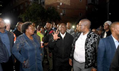 President Cyril Ramaphosa (centre) on a site visit to assess the damage from the fire tragedy at a residential building in Marshalltown, Johannesburg on 31 August 2023