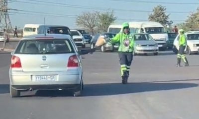 driver gave an Outsurance pointswoman flowers