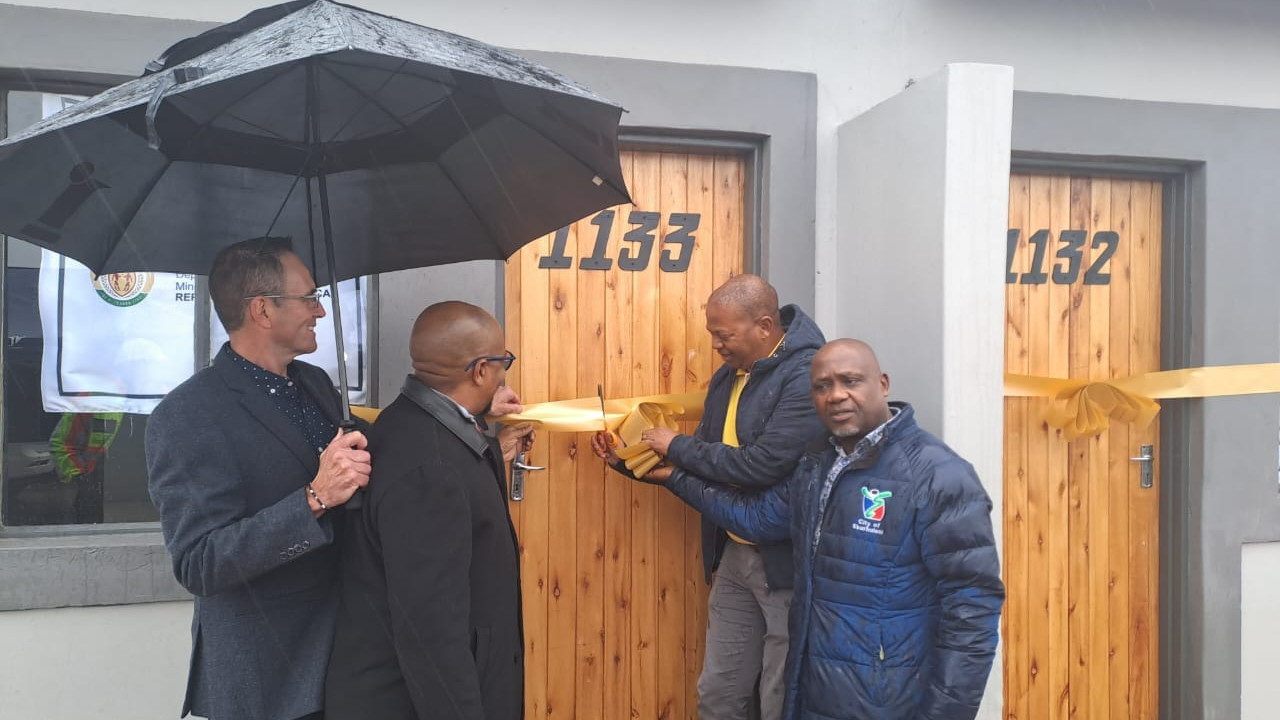 afrisam hands over low-cost houses